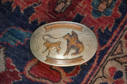 Comstock Roper with Desert Landscape Background Belt Buckle