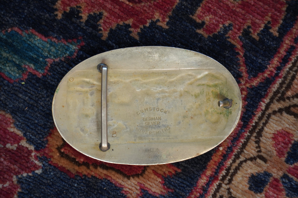 Small Comstock Roper with Desert Landscape Background Belt Buckle